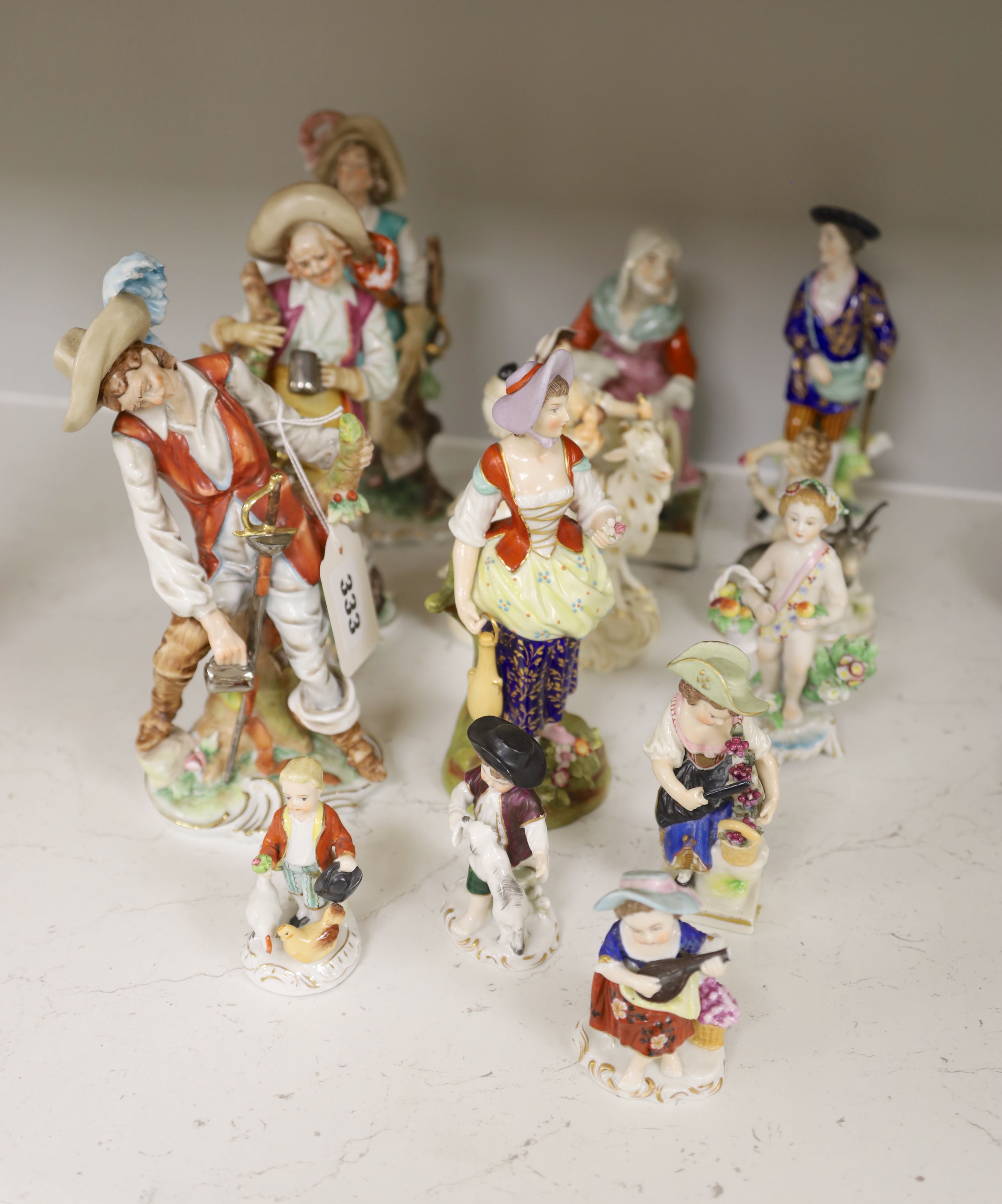 A Derby tailors wife group and twelve Continental or Staffs porcelain figures, tallest 20cm